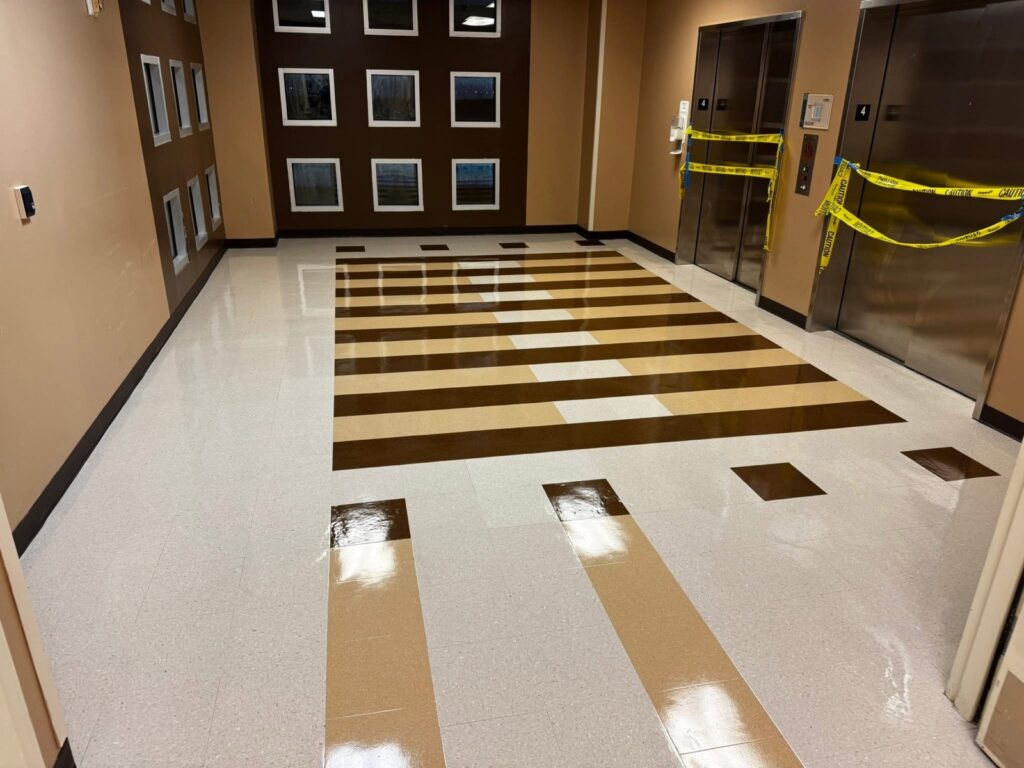 High-gloss VCT floor finish in an elevator lobby