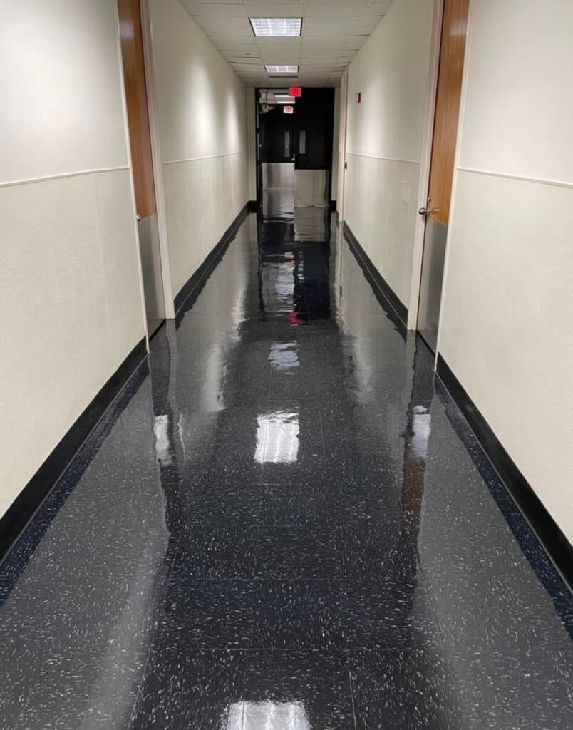 Glossy VCT hallway after strip and wax
